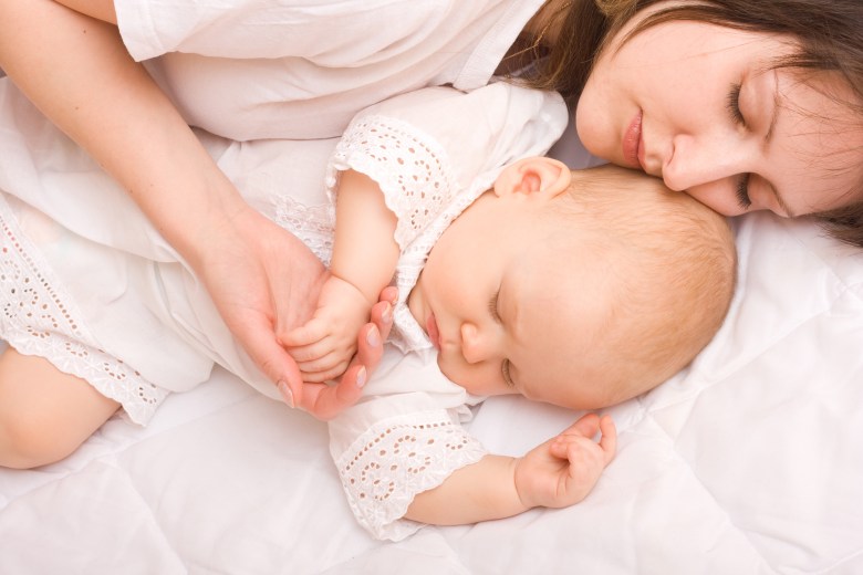 bigstock-baby-sleeping-with-mother-3018336.jpg