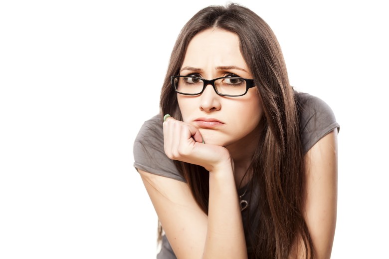 disappointed young woman with glasses